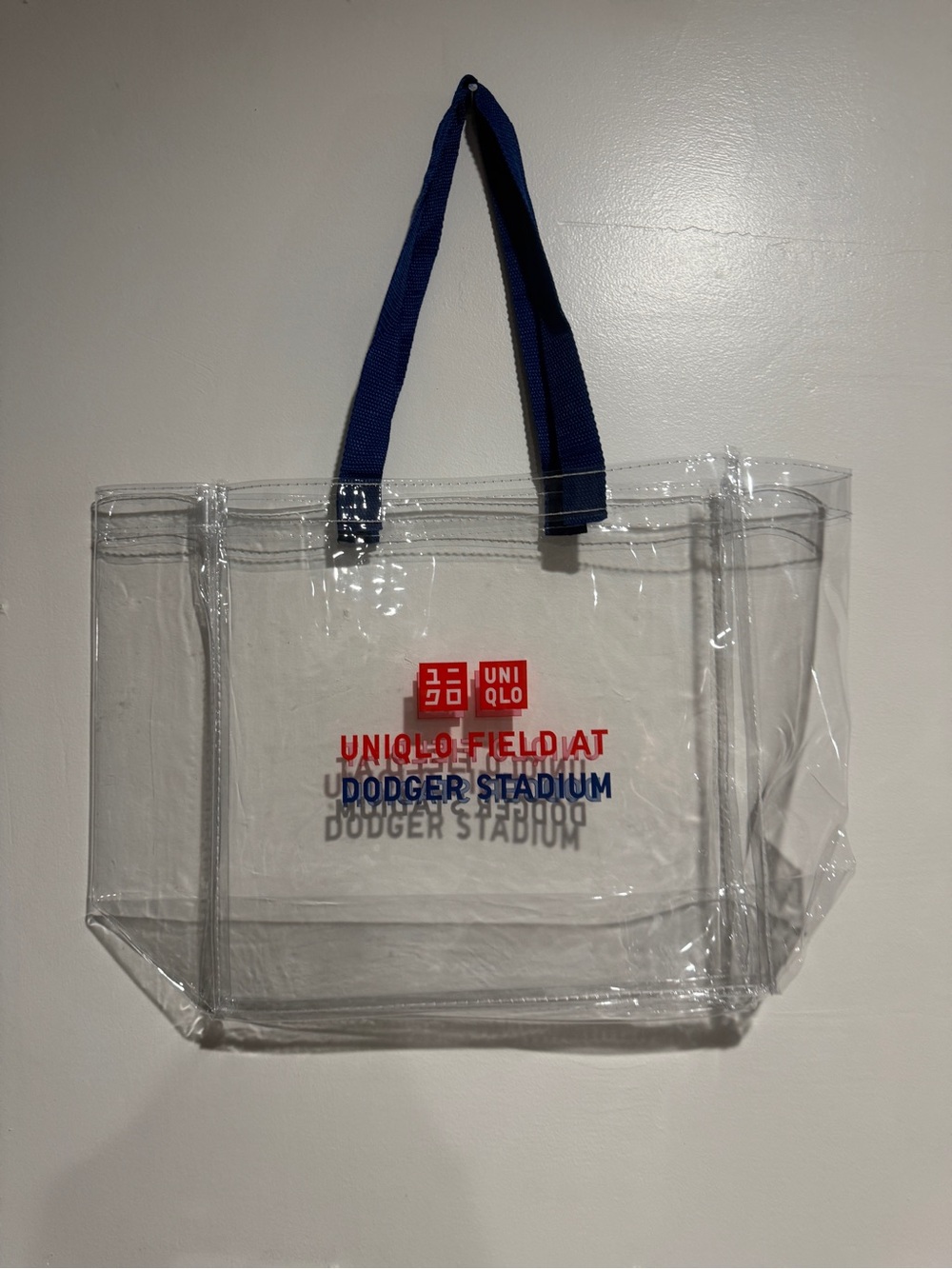 UNIQLO Clear Tote with Blue Handles and Red Logo